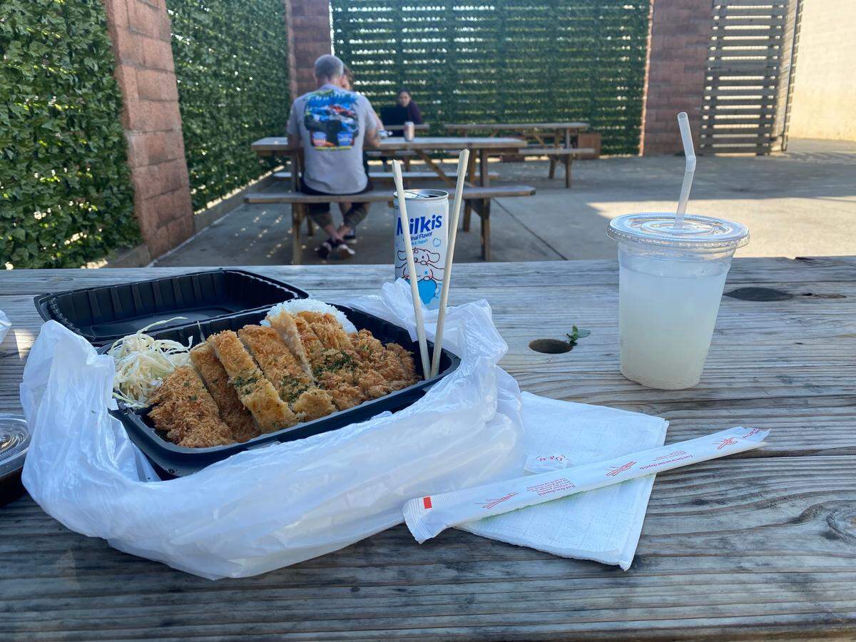 Tonkatsu from Mukja at Alley 51, along with original-flavored Milkis, a drink that blends carbonated water, sugar, milk and yogurt.