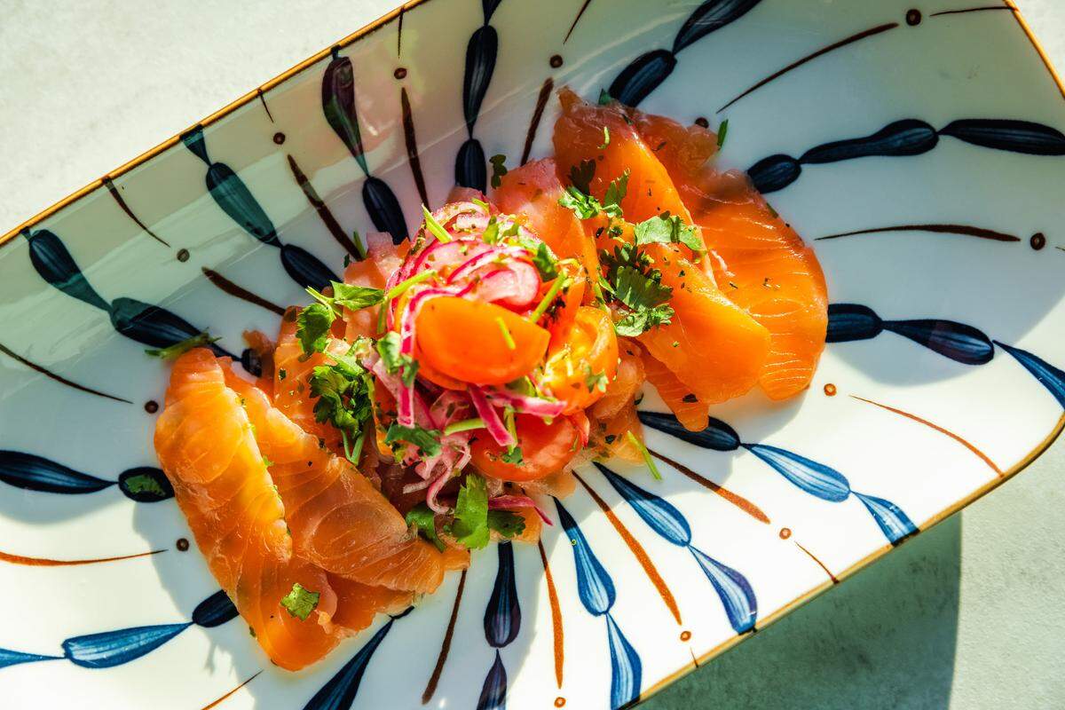 The Royal Tot’s Ginger Soy Salmon includes sauteed mushrooms and bok choy, topped with pickled carrots.