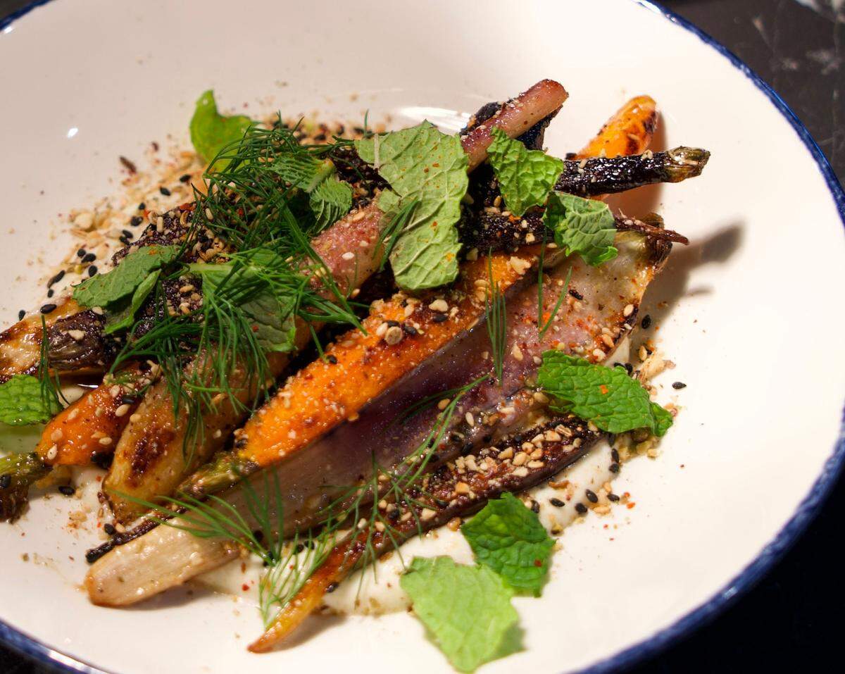 Henrietta’s carrots feature whipped ricotta, caramelized honey, dukkah and espelette.