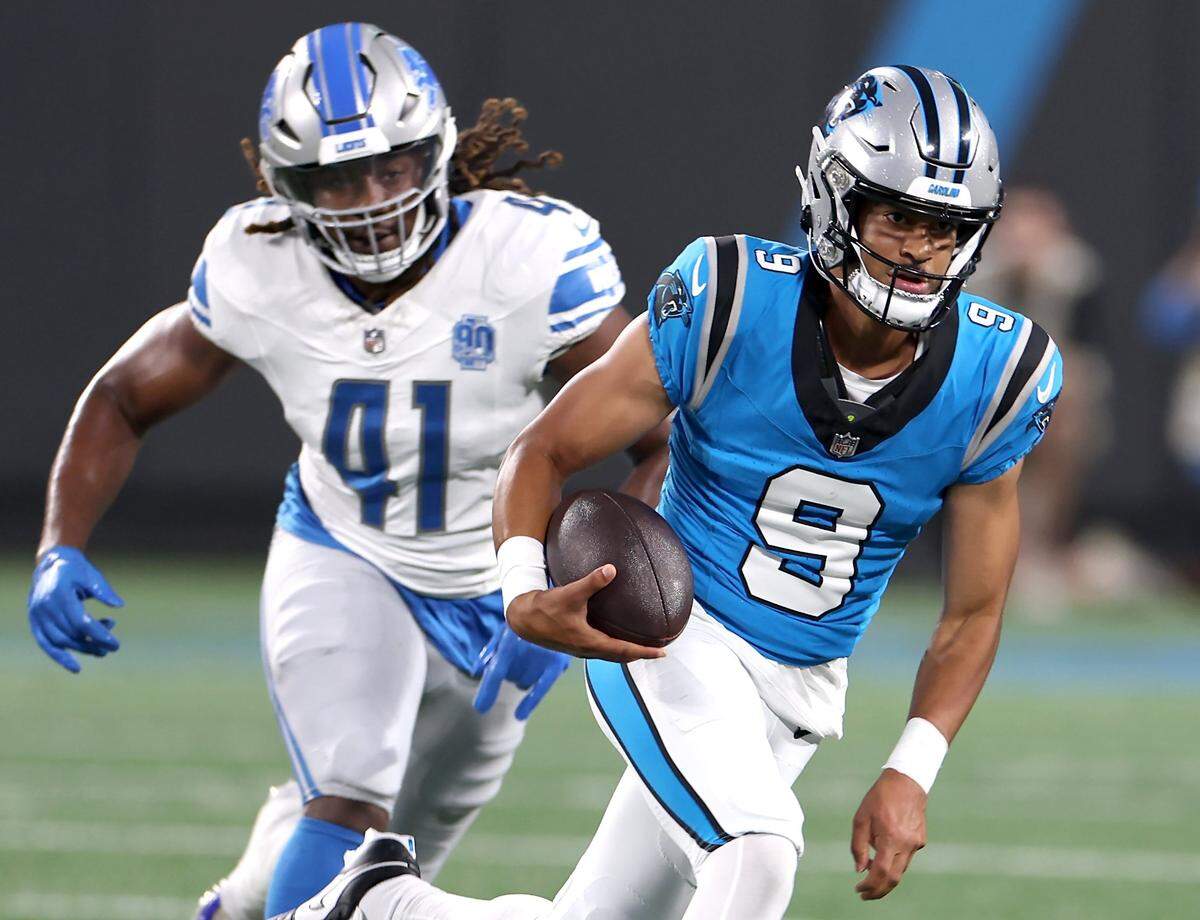 Carolina Panthers quarterback Bryce Young breaks to the outside on a run against the Detroit Lions defense during first quarter action on Friday, August 25, 2023 at Bank of America Stadium in Charlotte, NC.