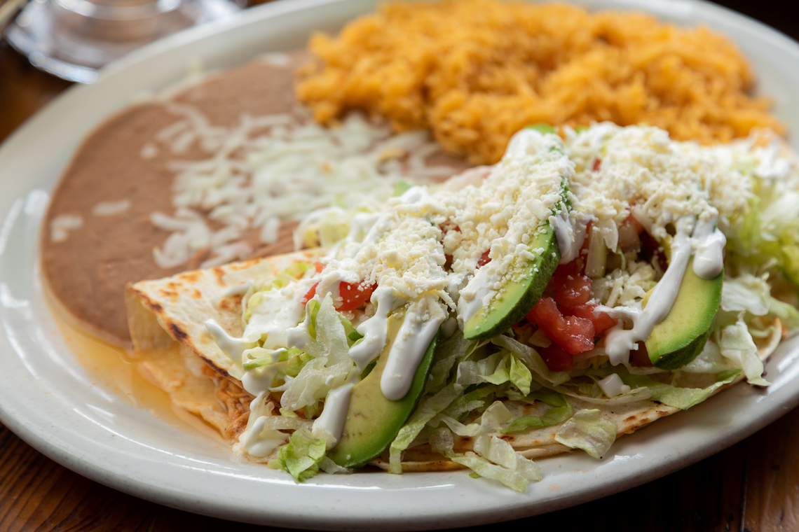 The Quesadilla Especial includes grilled shrimp, onion, lettuce, tomato, avocado, queso fresco and sour cream.