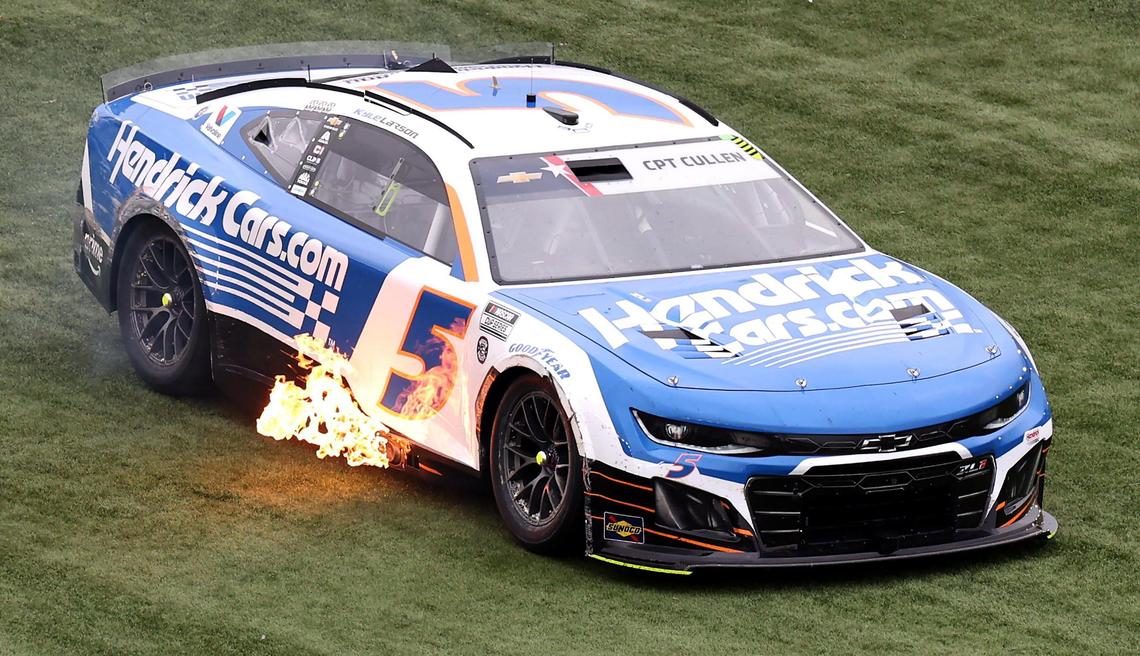NASCAR Cup driver Kyle Larson shoots flames from his exhaust as he tries to get his car started after sliding through the infield during the Coca-Cola 600 at Charlotte Motor Speedway in Concord, NC on Sunday, May 25, 2025.