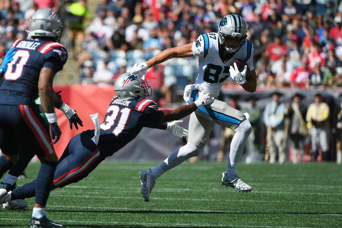 Carolina Panthers wide receiver Brycen Tremayne (87) runs past New England Patriots safety Craig Woodson (31) during Sunday’s first half at Gillette Stadium.