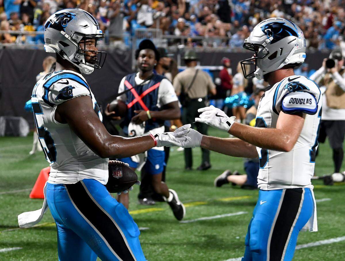 Carolina Panthers tight end James Mitchell, left, is congratulated by wide receiver Hunter Renfrow, right, following Mitchell's touchdown pass reception during action against the Pittsburgh Steelers at Bank of America Stadium in Charlotte, NC on Thursday, August 21, 2025.