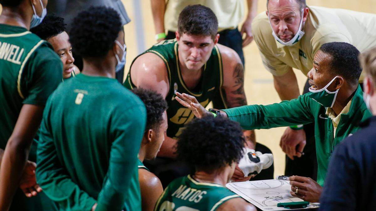 Charlotte 49ers basketball coach Ron Sanchez, right, pictured here during a game at Davidson last month, was impressed by his team’s ability to come back and beat WKU on Saturday.