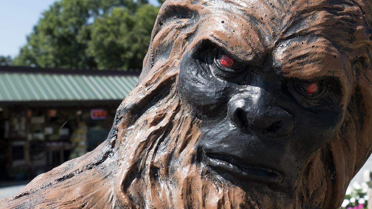 A Bigfoot statue is in a running pose in front of a produce/antique store in Biscoe, N.C., on Wednesday, July 19, 2017.