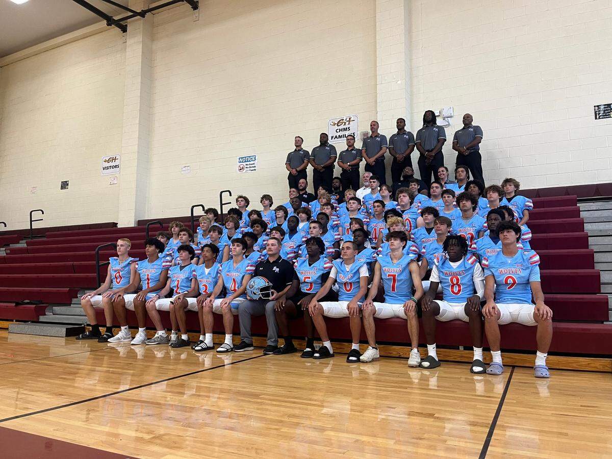 The inaugural football team at Ballantyne Ridge High School in south Charlotte poses for a team photo at Community House Middle School.