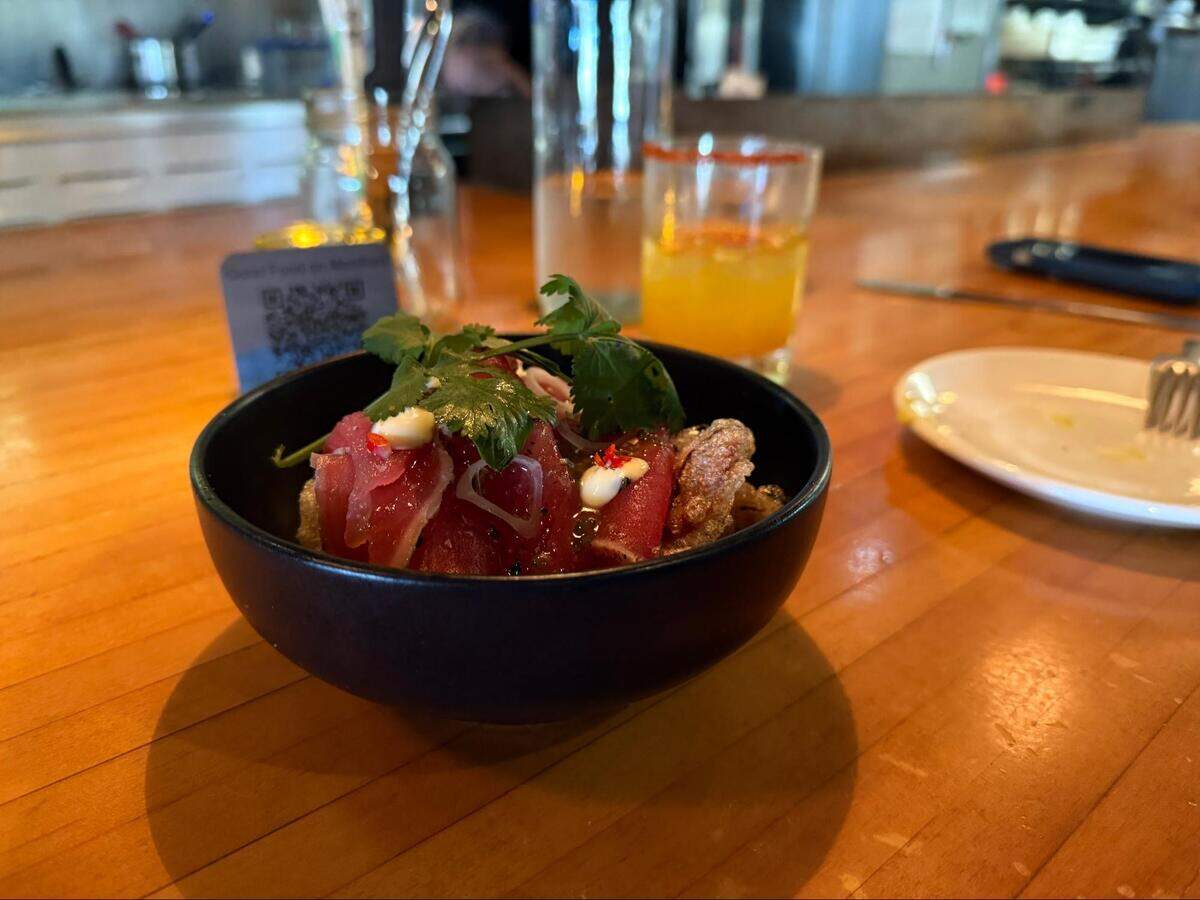 Tuna carpaccio with Thai basil and beef cracklin’ — one of the many bright, polished dishes on the menu at Good Food on Montford.