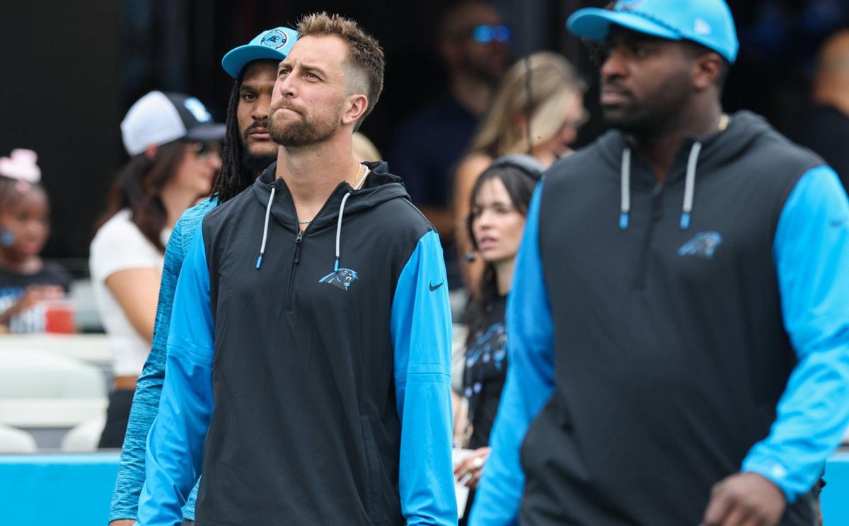 Panthers wide receiver Adam Thielen, left, walks onto the field after the National Anthem during the game against the Bengals at Bank of America stadium in Charlotte, NC on Sunday, September 29, 2024. Thielen was placed on the injured reserve list and did not play in today’s game.