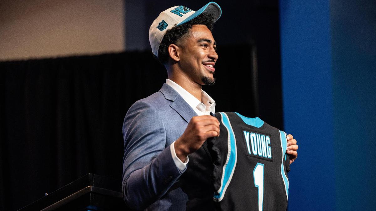 Carolina Panthers Bryce Young hold his jersey during a press conference at the Bank of America Stadium in Charlotte, N.C., on Friday, April 28, 2023.