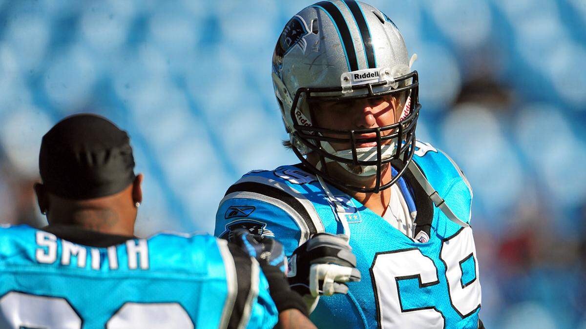 (L-R) Carolina Panthers wide receiver Steve Smith (89) and tackle Jordan Gross (69) greet one another on the field at Bank of America Stadium in Charlotte, NC on Sunday, October 30, 2011 prior to action vs the Minnesota Vikings. Jeff Siner - jsiner@charlotteobserver.com
