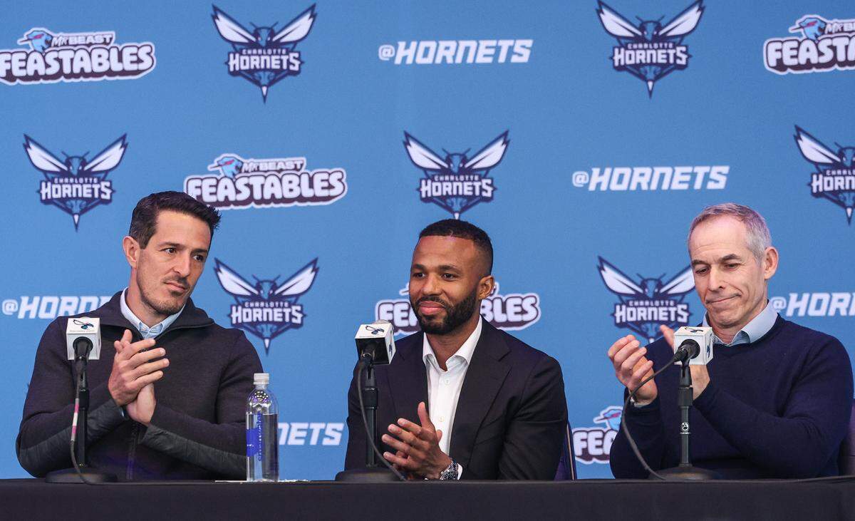 Charlotte Hornets Co-Chairmen Gabe Plotkin, left, and Rick Schnall, right, announce Jeff Peterson, center, as its Executive Vice President of Basketball Operations during a press conference at Spectrum Center on Wednesday, March 6, 2024. Peterson becomes the organization’s chief basketball decision maker while also being responsible for leading the team’s day-to-day basketball operations.