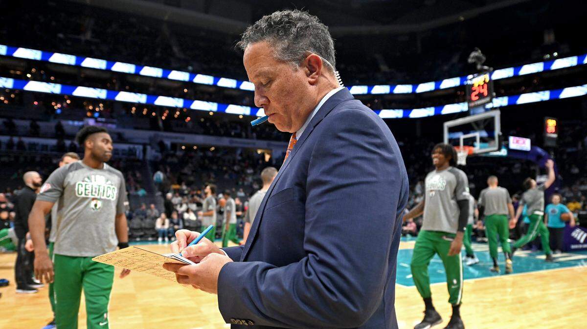 Charlotte Hornets play-by-play sports announcer Eric Collins takes notes prior to conducting a pregame segment with color commentator Dell Curry on Wednesday, March 9, 2022. The Charlotte Hornets faced the Boston Celtics in NBA action at Spectrum Center.