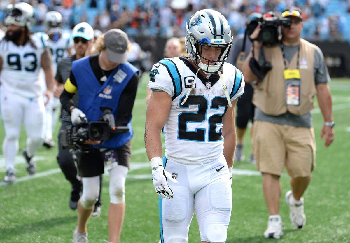 Carolina Panthers running back Christian McCaffrey walks off the field dejected following the teams 26-24 loss to the Cleveland Browns at Bank of America Stadium on Sunday, September 11, 2022.