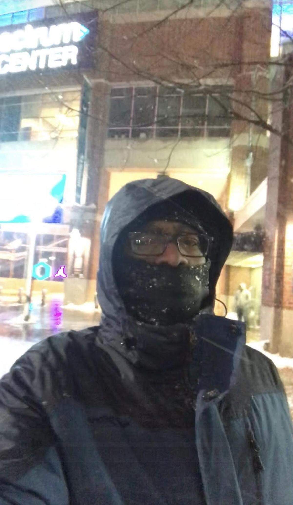 Norman Patton walks through a snowy uptown Charlotte on Jan. 17, 2018.
