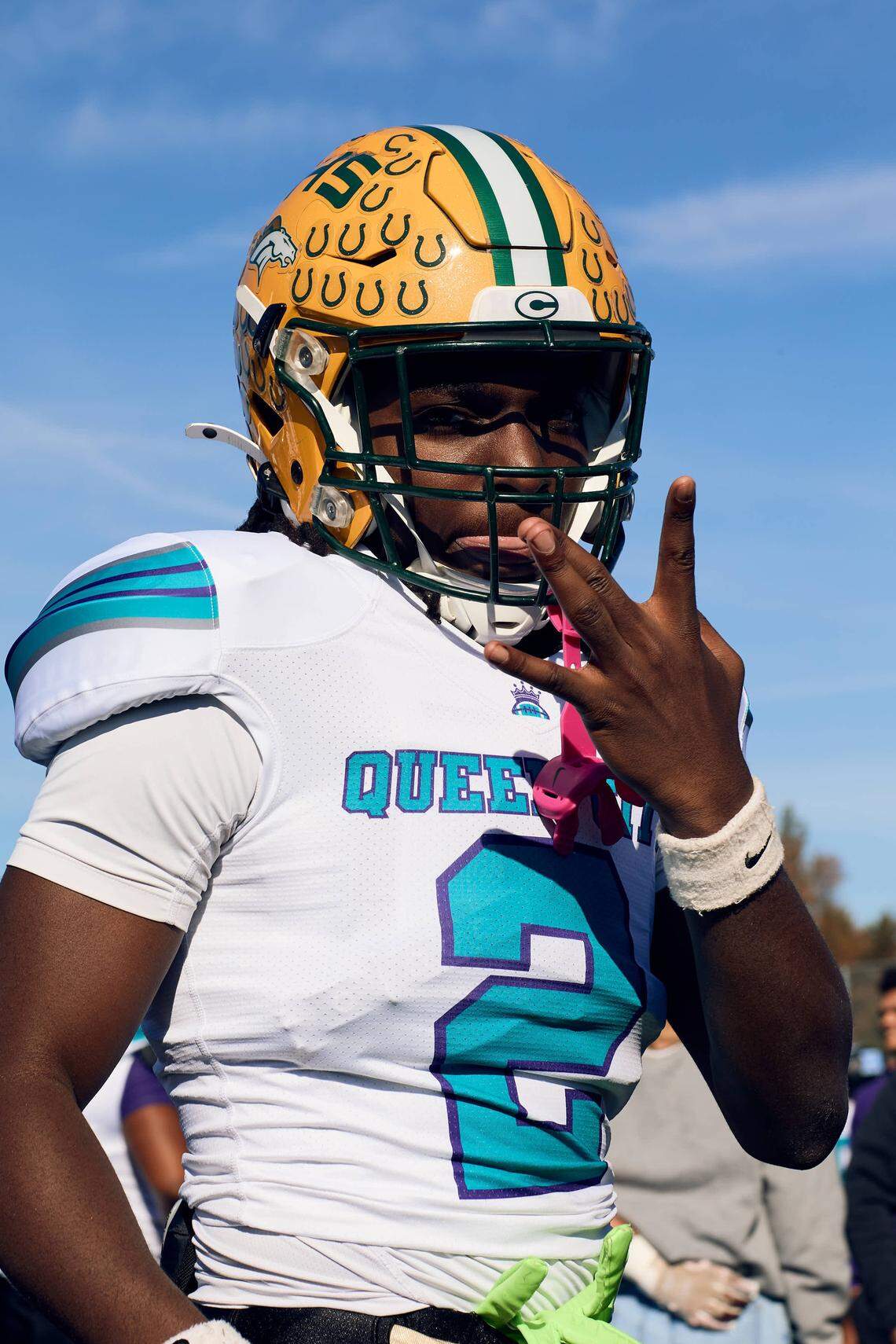 Crest WR Michael Edwards (2) flashes the W for his West Team prior to the start of the Queen City Senior Bowl hosted at Olympic High School.