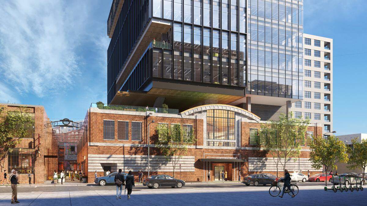 A Charlotte developer is proposing to build a glass office tower atop a historic landmark in South End.