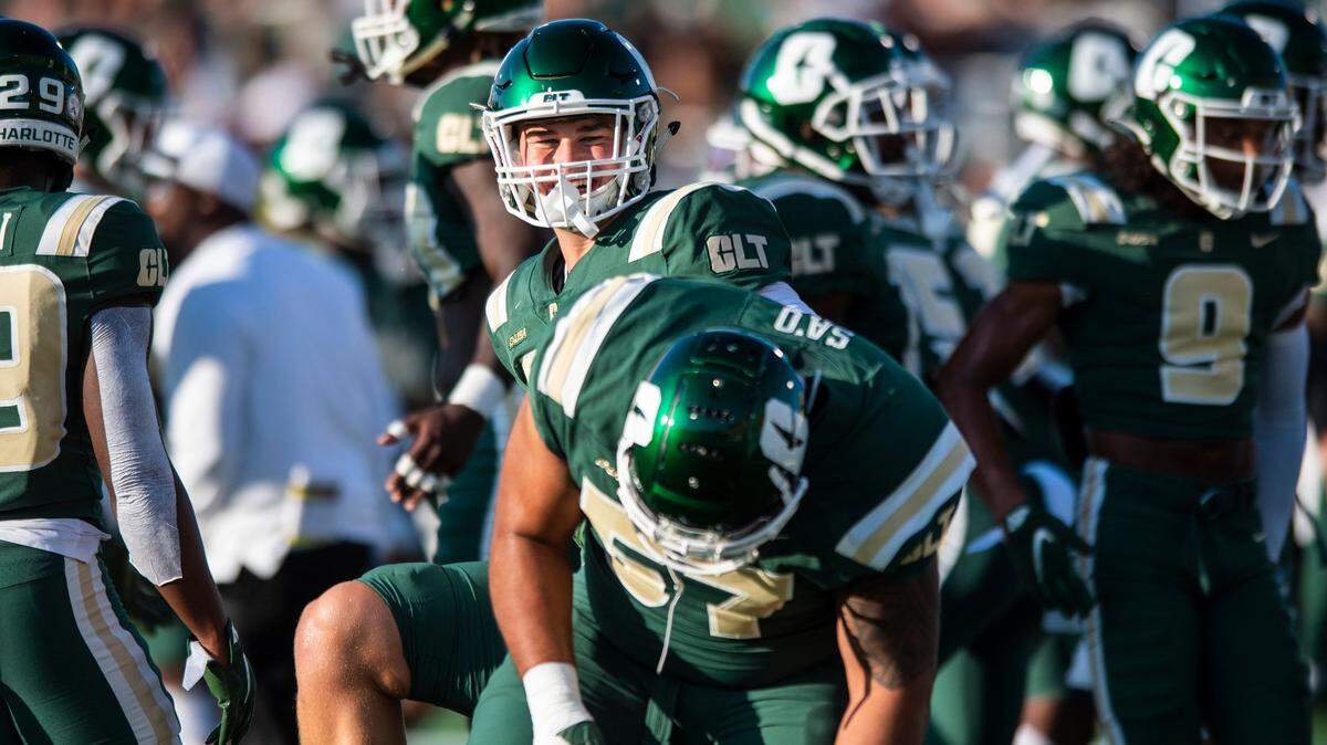 Charlotte 49ers kicker Jonathan Cruz, left center, is part of a special teams unit that is among the best in college football.