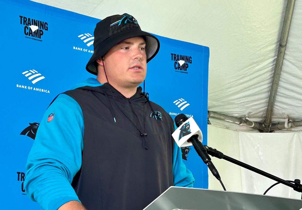 Carolina Panthers offensive guard Austin Corbett answers questions from the media on Sunday, Aug. 6, 2023.