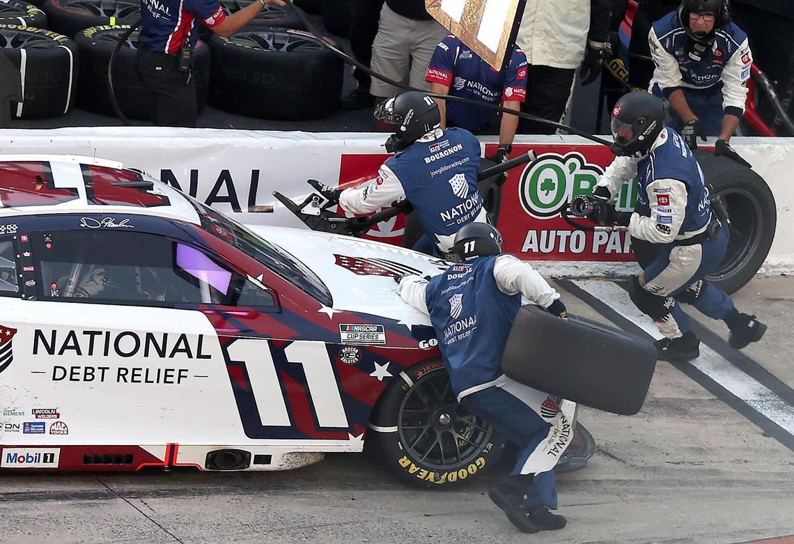 NASCAR Cup Series driver Denny Hamlin’s pit crew run around their car during a pit stop during the Coca-Cola 600 at Charlotte Motor Speedway in Concord, NC on Sunday, May 25, 2025.