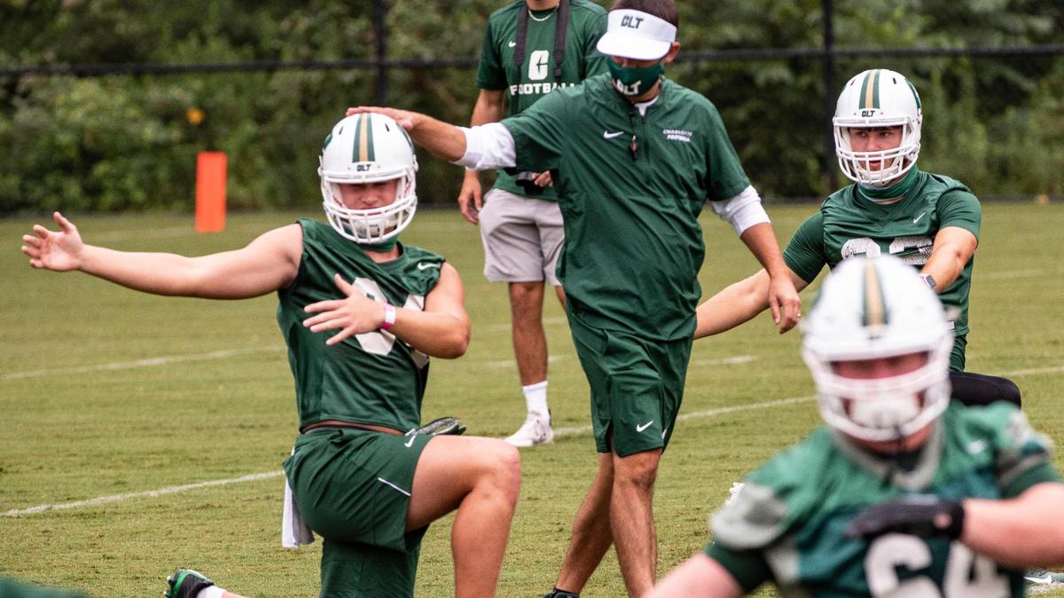Charlotte 49ers coaches wore masks as preseason camp began Friday.