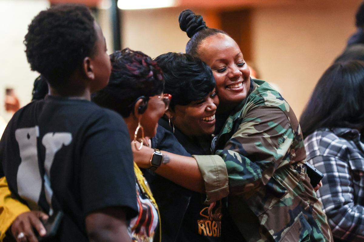 Members of the Robinson family hug during a rally calling for justice for Shanquella Robinson at Little Rock A.M.E. Zion Church on Saturday.