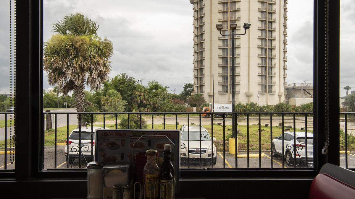 Waffle House Vistas, which features the built environment as seen from the interiors of restaurants across the Southeast, is on exhibit at UNC Charlotte’s Storrs Gallery through Sept. 20.