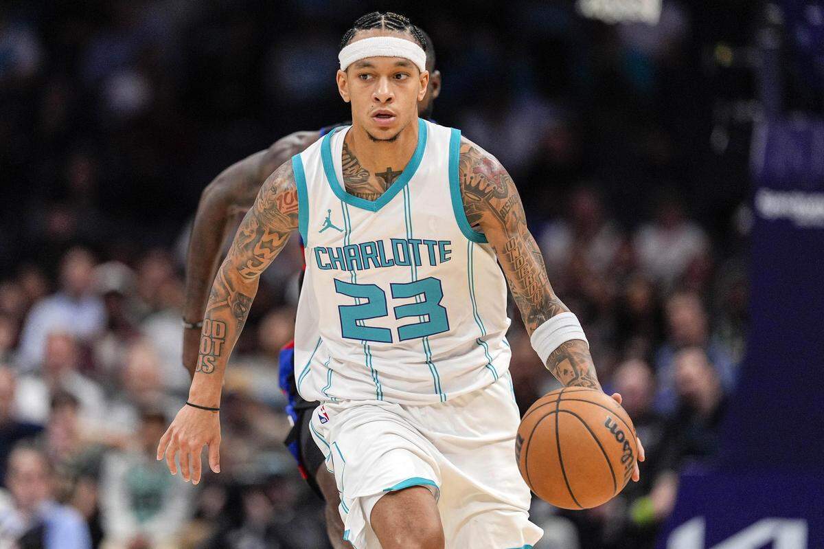 Nov 6, 2024; Charlotte, North Carolina, USA; Charlotte Hornets guard Tre Mann (23) handles the ball against the Detroit Pistons during the second half at Spectrum Center. Mandatory Credit: Jim Dedmon-Imagn Images