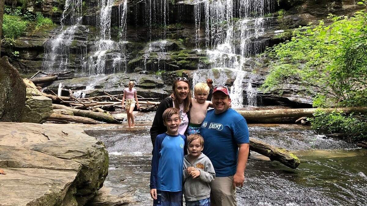 The O’Daniel family at Station Cove Waterfall, part of Oconee Station State Park.