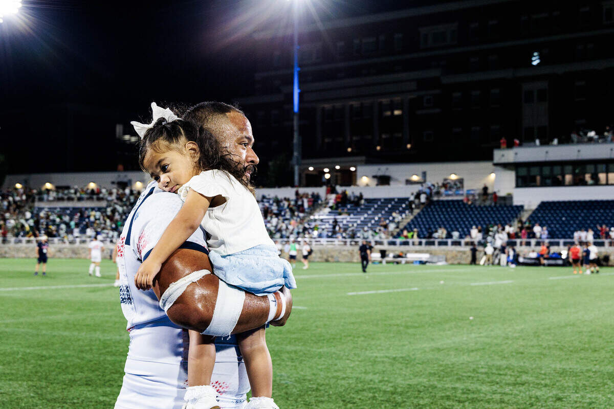 USA Men's Eagles Tonga Kofe carries his daughter onto the field after the USA’s win against Zimbabwe in the inaugural World Rugby Nations Cup on Saturday, July 11, 2026 at the American Legion Memorial Stadium in Charlotte, NC.