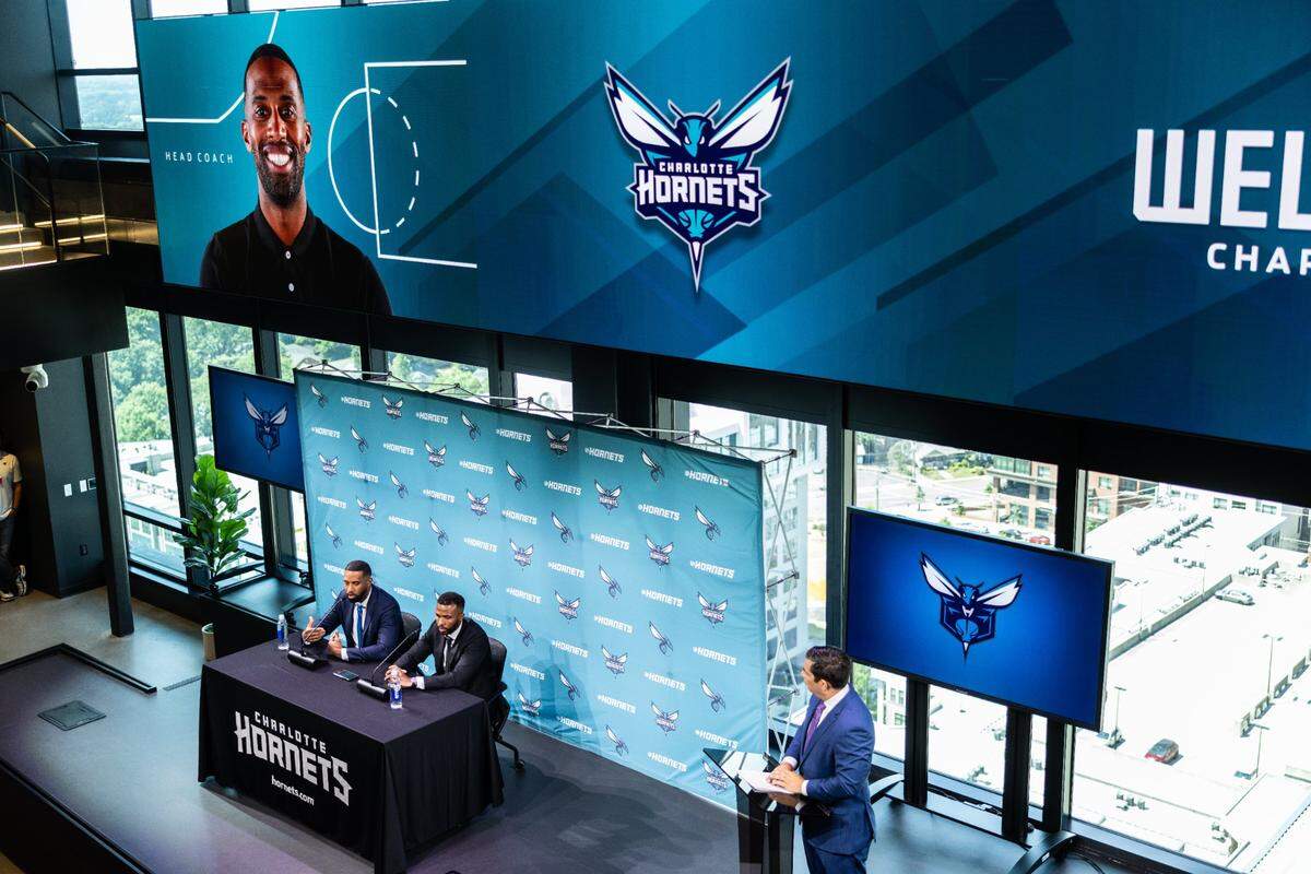 The new Charlotte Hornets coach Charles Lee and Jeff Peterson, Executive Vice President Of Basketball Operations, speak during a press conference in Charlotte, N.C., on Tuesday, June 25, 2024.