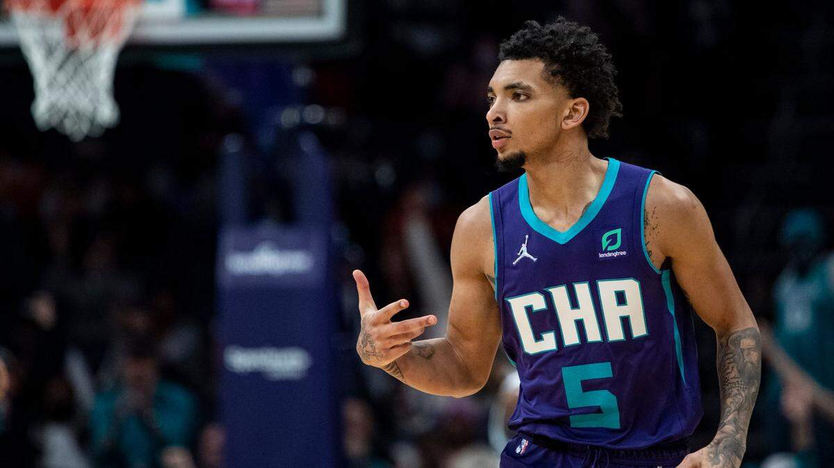 Charlotte Hornets guard James Bouknight (5) celebrates a three-point basket during the second half of an NBA basketball game against the Sacramento Kings, Friday, Dec. 10, 2021, in Charlotte, N.C. (AP Photo/Matt Kelley)