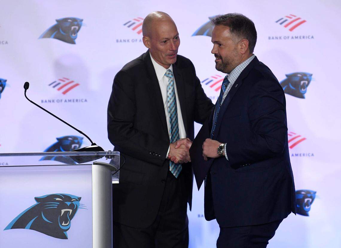 Carolina Panthers play-by-play announcer Mick Mixon, left, introduces head coach Matt Rhule during his introductory press conference at Atrium Health Dome on Jan. 8, 2020.