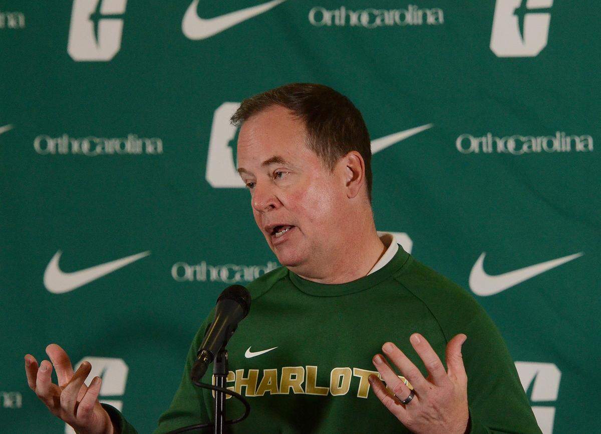 Charlotte 49ers Director of Athletics Mike Hill discusses the decision to fire head football coach Biff Poggi during Tuesday’s press conference at the Judy Rose Center on UNCC’s campus.