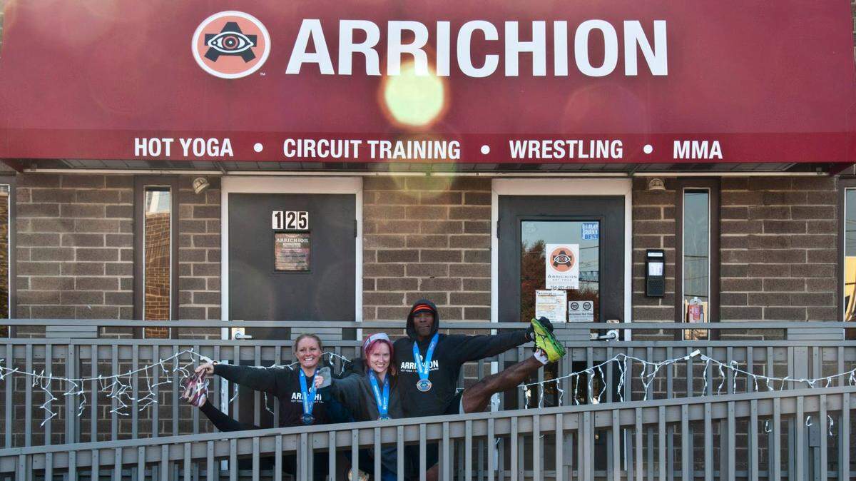 Quinn Reynolds, Melissa Oyler and Titus Tard at Arrichion Hot Yoga after the Charlotte Marathon in 2014.