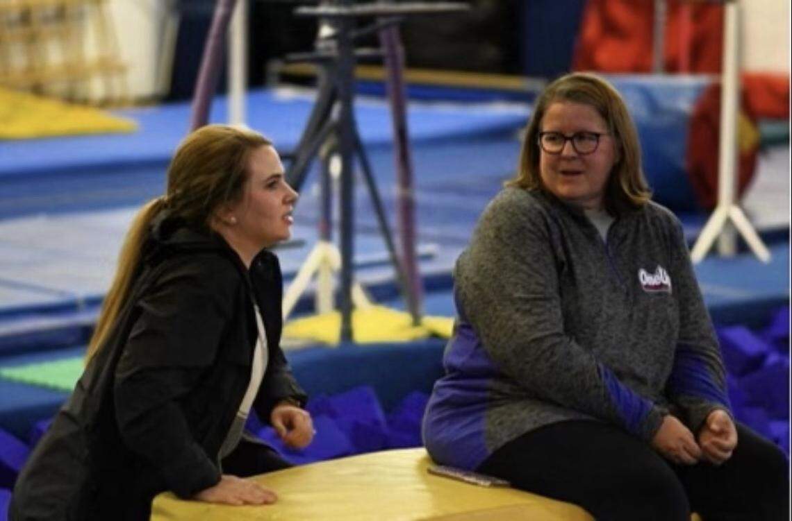 Julie O’Brien, right, with Charlotte Allstar coach Kendyl Brewer at the gym in Matthews.