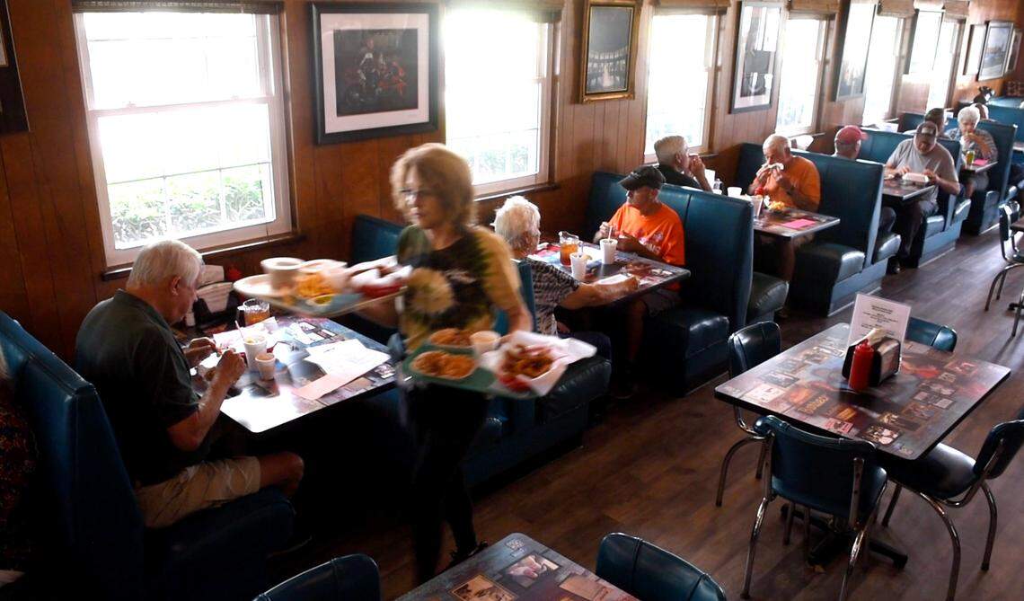 Customers enjoy a barbecue lunch at Red Bridges Barbecue Lodge in Shelby, NC on Wednesday, September 1, 2021.