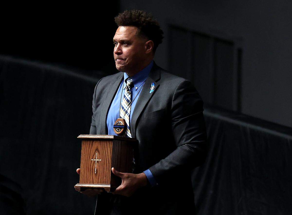 Deputy U.S. Marshal Ryan King carries the remains of his good friend and fellow U.S. Marshal Thomas Weeks Jr. at Bojangles Coliseum in Charlotte, NC on Monday, May 6, 2024. U.S. Marshal Thomas Weeks Jr., died during a standoff with a gunman on Monday, April 29th 2024. Two other law enforcement officers were also killed in the shootout. CMPD Officer Joshua Eyer passed away later Monday evening from injuries sustained during the shootout.