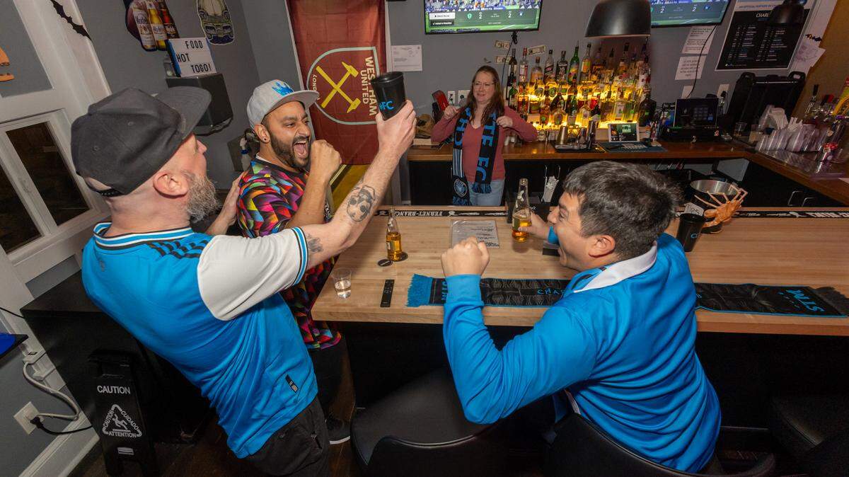At Copperhead Social Club, Alex Beebe, Ahmad Abusamak, Hannah Huggins and Hector Alvarez Granda celebrate after a game-tying goal.