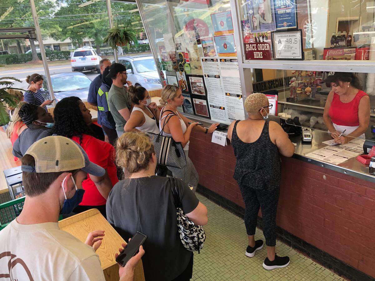 Customers line up to place their orders at Zack’s Hamburgers on Monday, June 28, 2021. The restaurant closed its door on July 01, 2021.