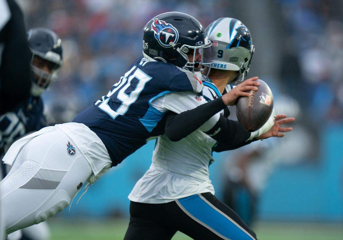 Tennessee Titans linebacker Arden Key (49) sacks Carolina Panthers quarterback Bryce Young (9) and creates a fumble during their game at Nissan Stadium in Nashville, Tenn., Sunday, Nov. 26, 2023.