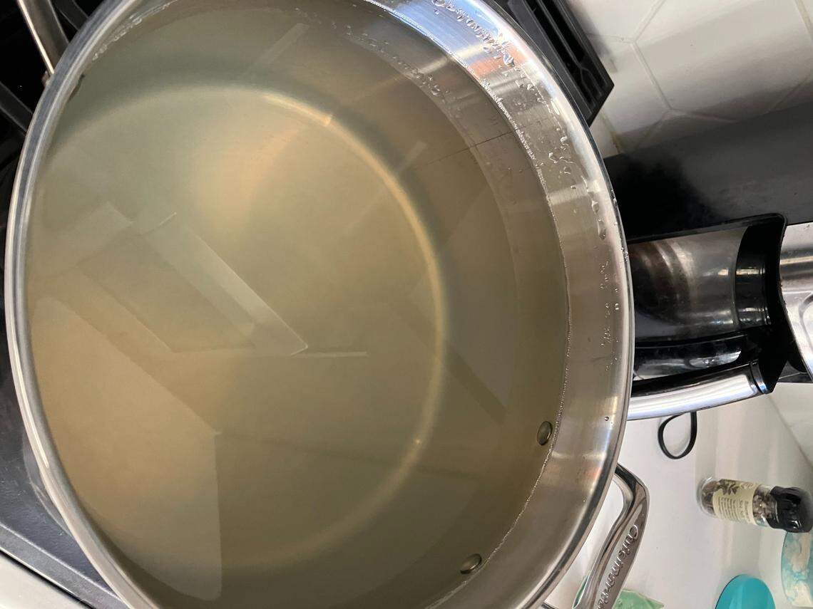 When Asheville residents open their taps, the water that comes out remains murky - and undrinkable. Residents are still under notice that they must boil the water before drinking it. The water in this pan came from an Asheville couple’s kitchen tap in late October.