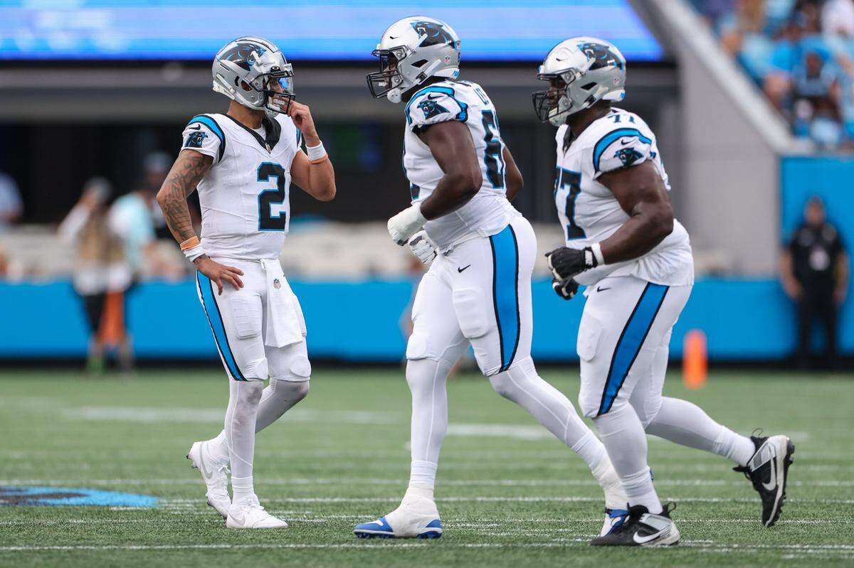 Panthers quarterback Matt Corral, left, waits for teammates after a scoreless series during the pre-season game against the Jets at Bank of America Stadium on Saturday, August 12, 2023 in Charlotte, NC.