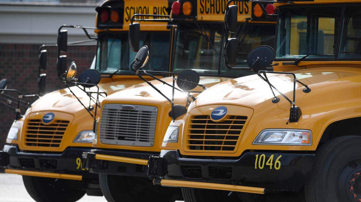 Buses wait for students to board at the end of the day at Ballantyne Elementary School on Tuesday, March 9, 2021.