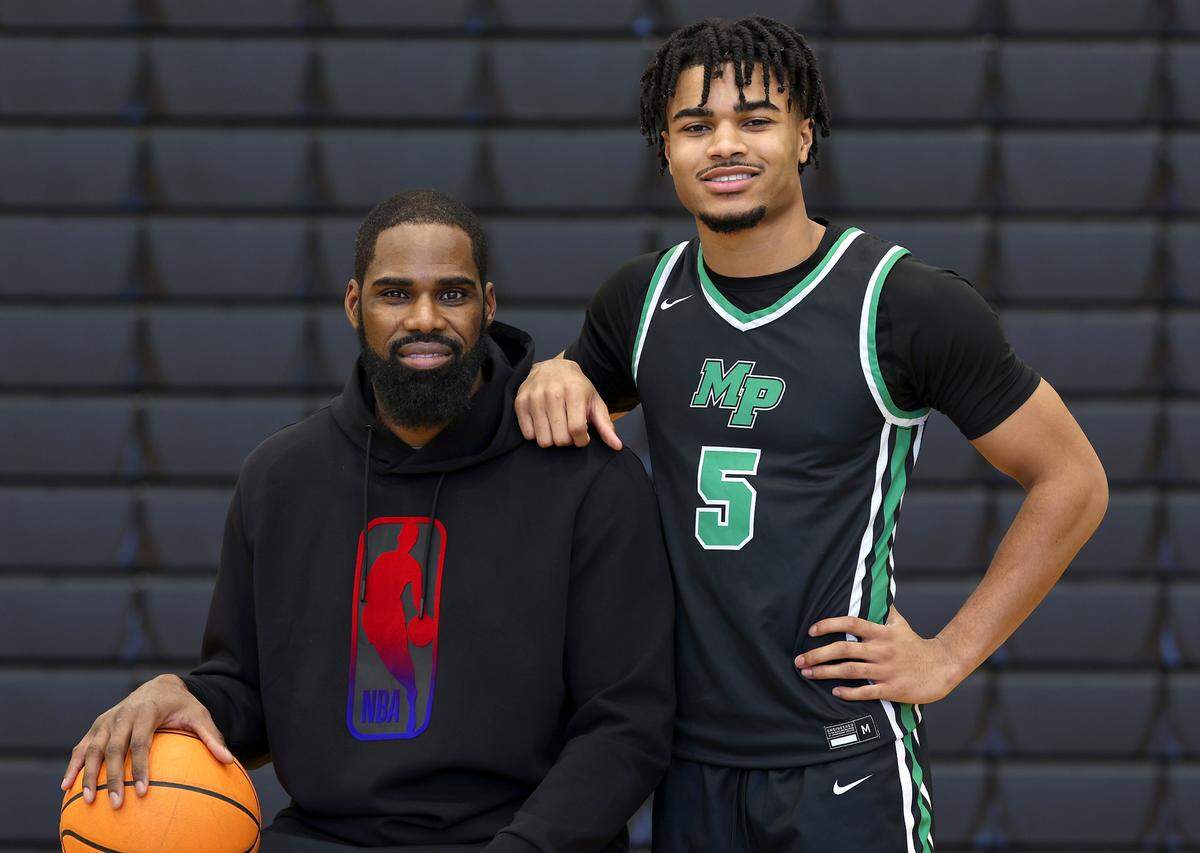 Former UNC great and NBA star Antawn Jamison, left and his son, AJ Jamison, right, on Wednesday, January 15, 2025 at Myers Park High School. AJ Jamison is enjoying a really good senior season at Myers Park which is trying to win the league title.