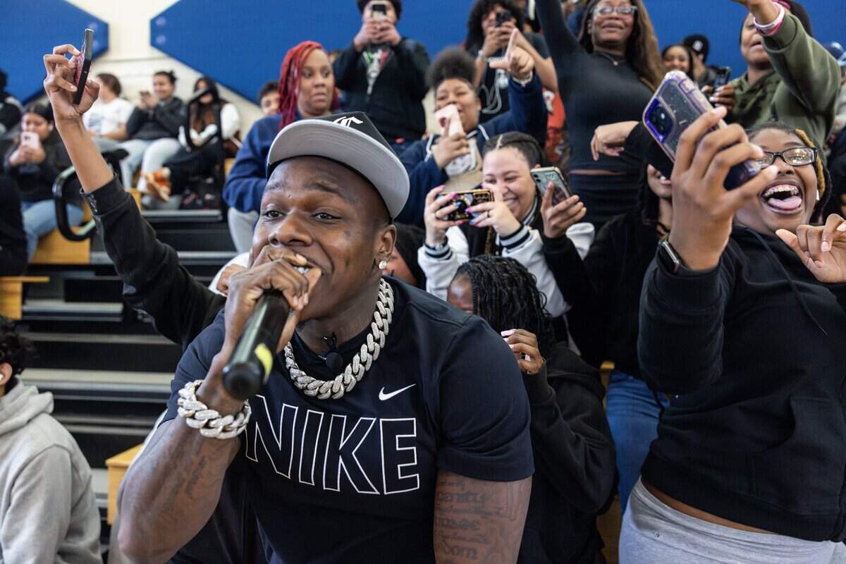 Rapper DaBaby performs a surprise concert at Garinger High School in Charlotte, N.C., on Monday, April 22, 2024. He is opening a restaurant in Charlotte called No Knife Chicken & Waffles.