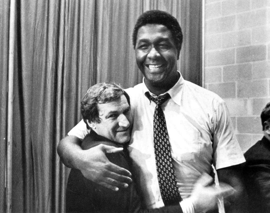 Georgetown coach John Thompson (right) hugs UNC coach and close friend Dean Smith after Smith’s Tar Heels defeated Thompson’s Hoyas, 63-62, in the 1982 NCAA championship game.