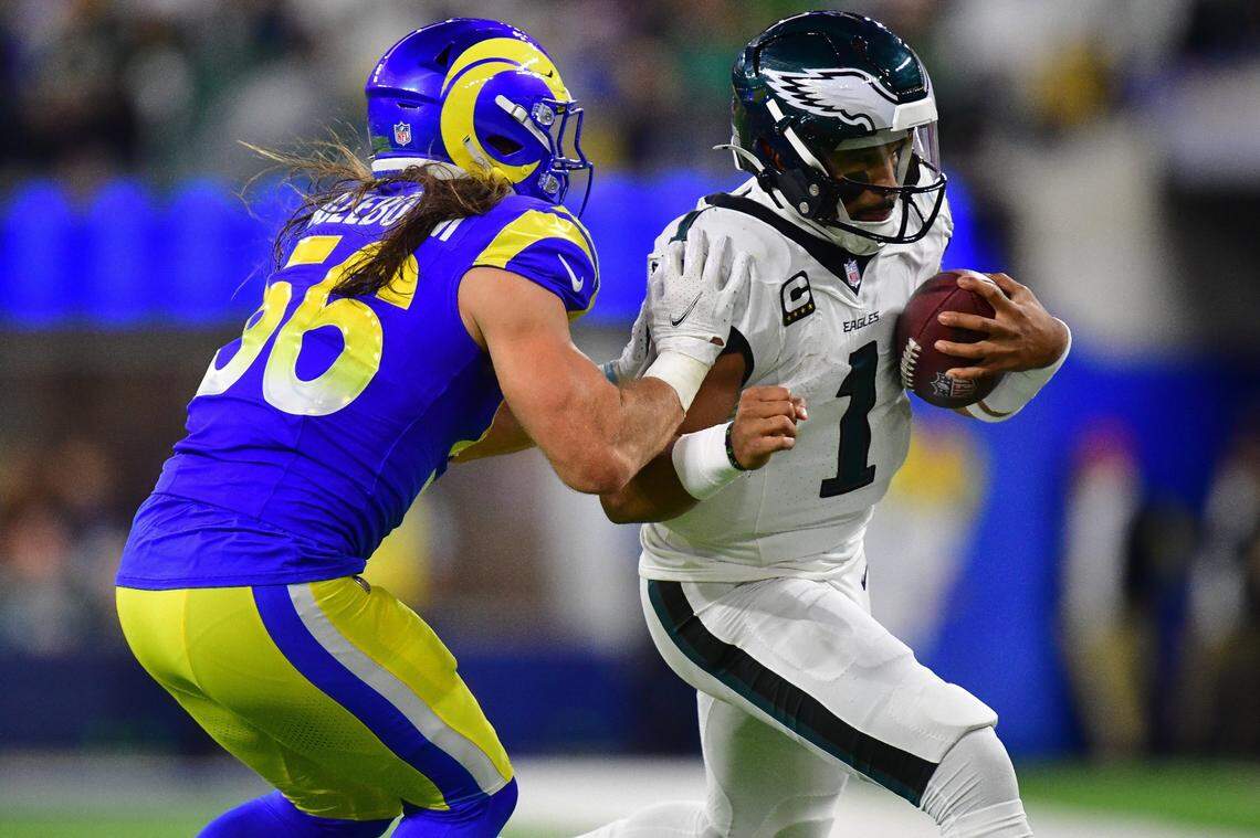 Nov 24, 2024; Inglewood, California, USA; Philadelphia Eagles quarterback Jalen Hurts (1) runs the ball against Los Angeles Rams linebacker Christian Rozeboom (56) during the first half at SoFi Stadium. Mandatory Credit: Gary A. Vasquez-Imagn Images