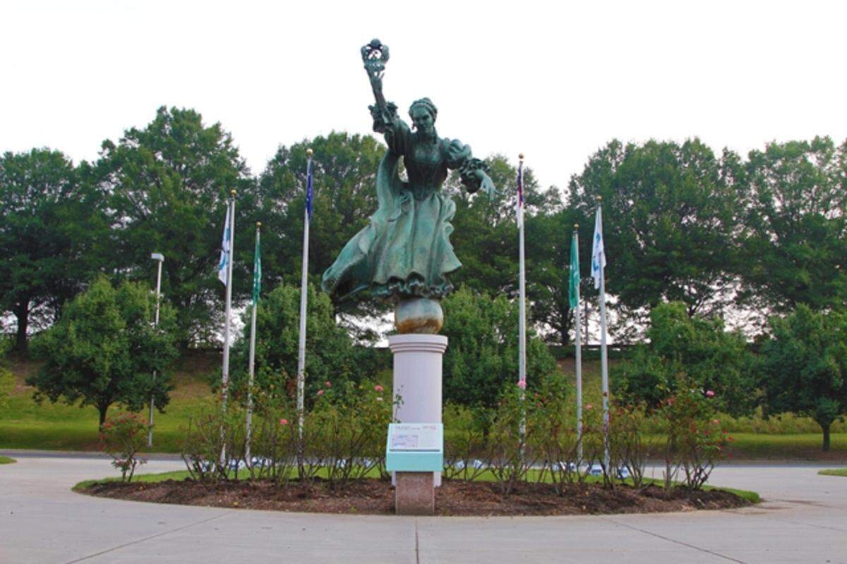 The iconic 15-foot-tall Queen Charlotte bronze statue will return to Charlotte Douglas International Airport in the center of the terminal lobby.