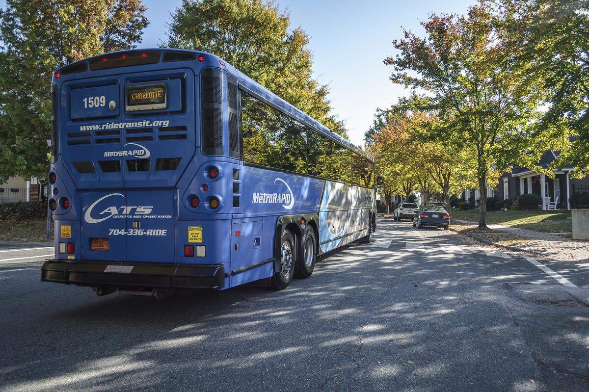 A CATS express bus travels a Charlotte street.